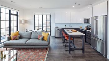 Gray slate tiled kitchen floors with polished white, glass subway tile backsplash